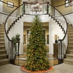 National Tree Company Pre-Lit Artificial Slim Christmas Tree, Green, Dunhill Fir, White Lights, Includes Stand, 9 Feet