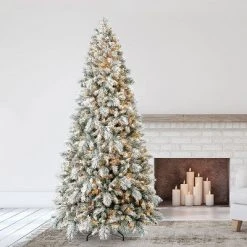 Home Heritage Pre-Lit Snowdrift Flocked Artificial Holiday Tree, Clear Lights, Natural-Looking PVC Foliage Tips, Metal Stand