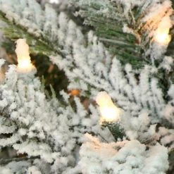 Primo International Puleo International 7.5 Foot Flocked Aspen Fir Prelit Artificial Christmas Tree w/1,319 Branch Tips, 700 Clear Lights, Hinged Branches, & Metal Stand